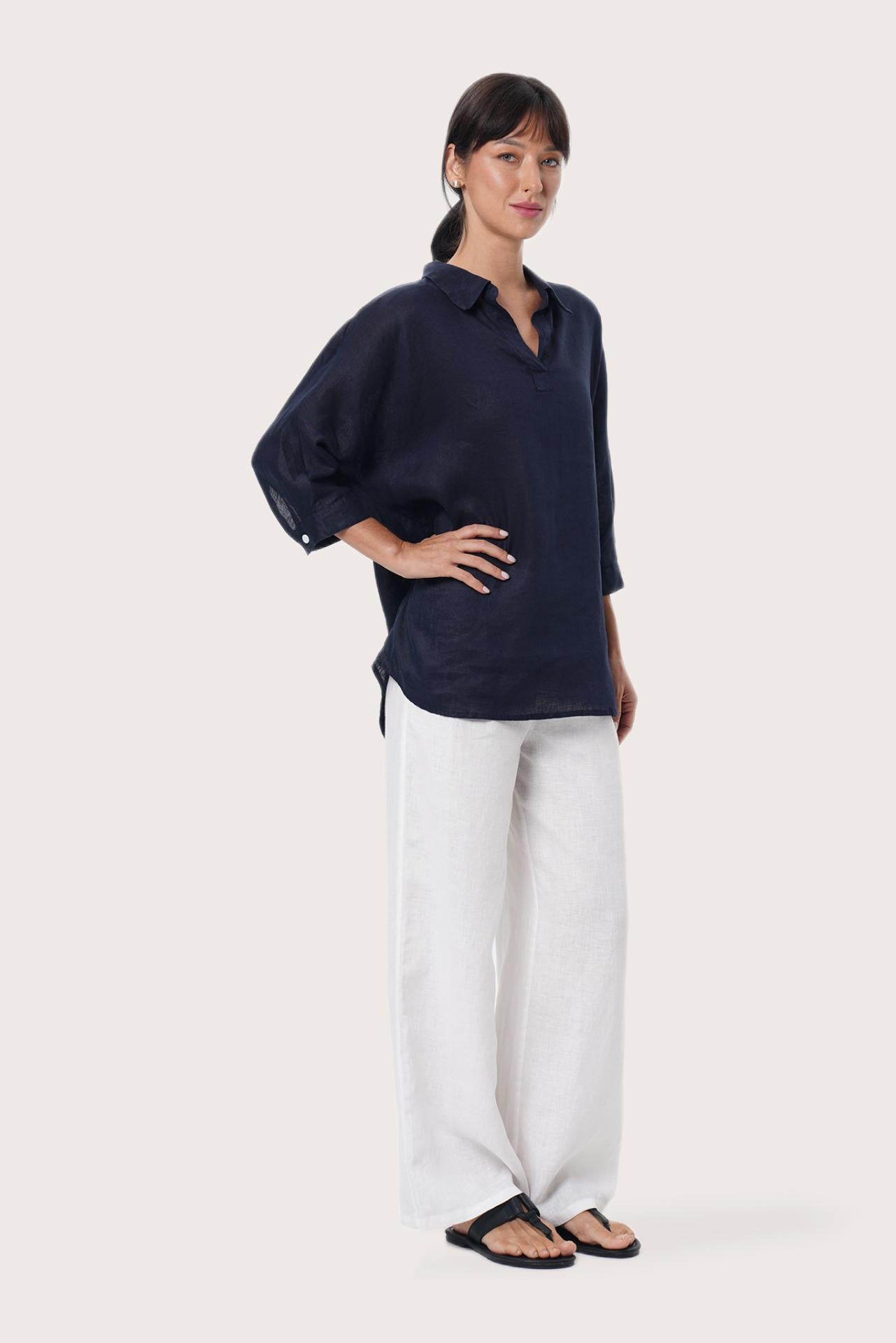 By The Sea Bali Side profile of the Faye Linen Shirt in Navy showcasing its relaxed fit