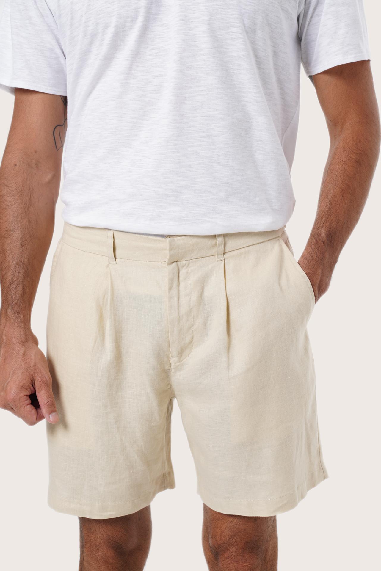 Side view of the Gaara Linen Bermuda in Cream highlighting the tailored fit by By The Sea Bali