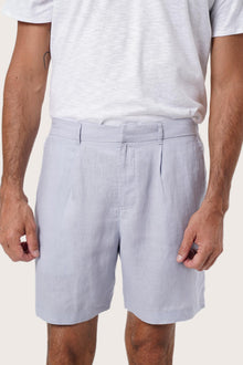 Side view of the Gaara Linen Bermuda in Light Blue highlighting the tailored fit by By The Sea Bali