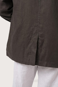 Detailed back view highlighting the linen construction and relaxed silhouette
