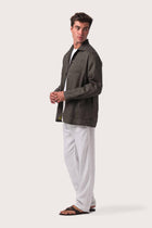 Side profile of the grey choco linen jacket showcasing its comfortable fit and effortless drape