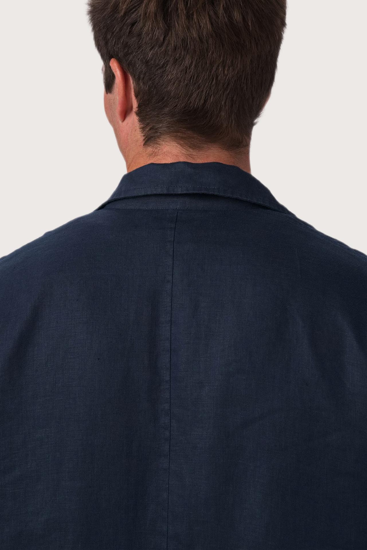 Detailed back view highlighting the linen construction and relaxed silhouette