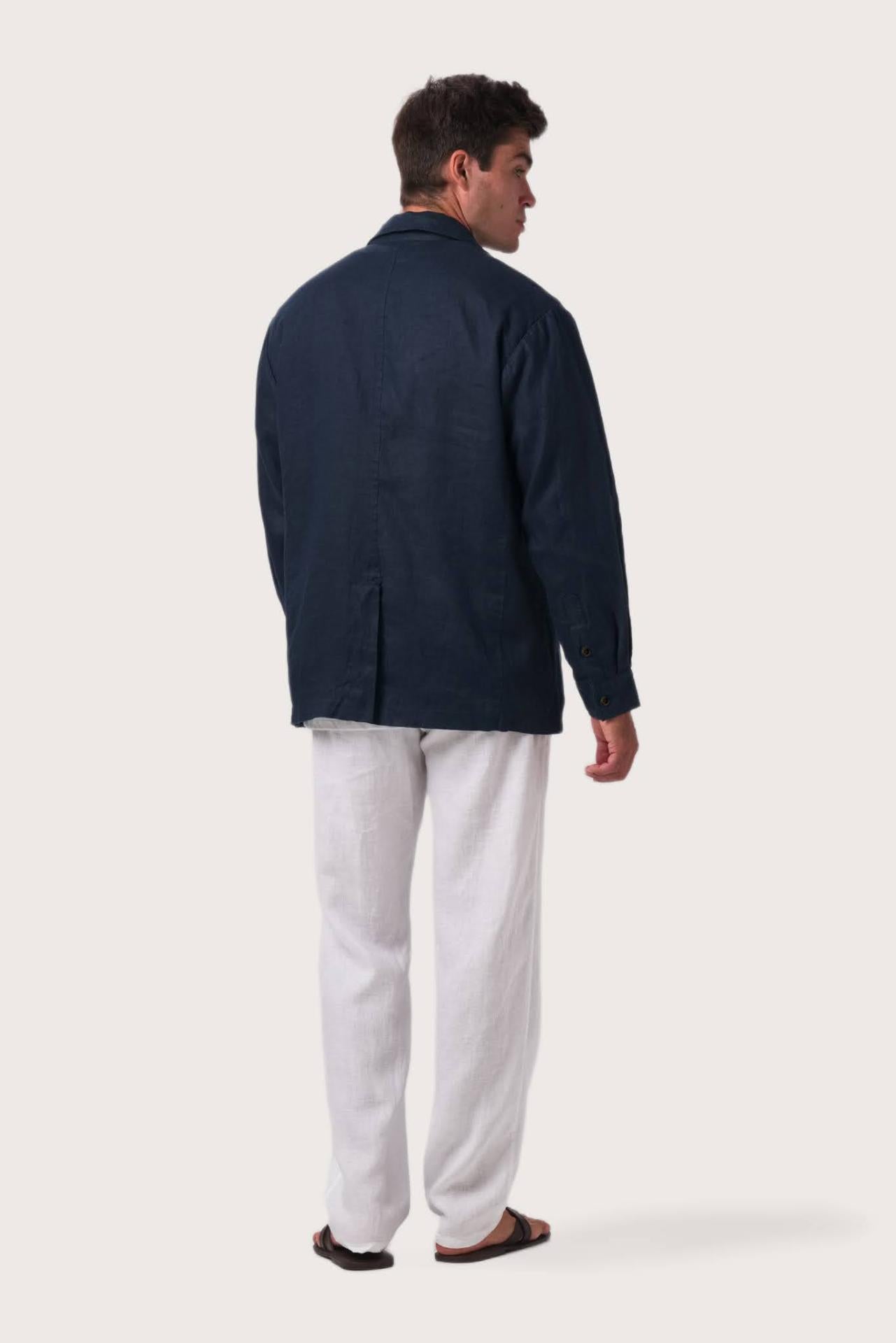 Back view of the navy linen jacket with a relaxed and contemporary silhouette