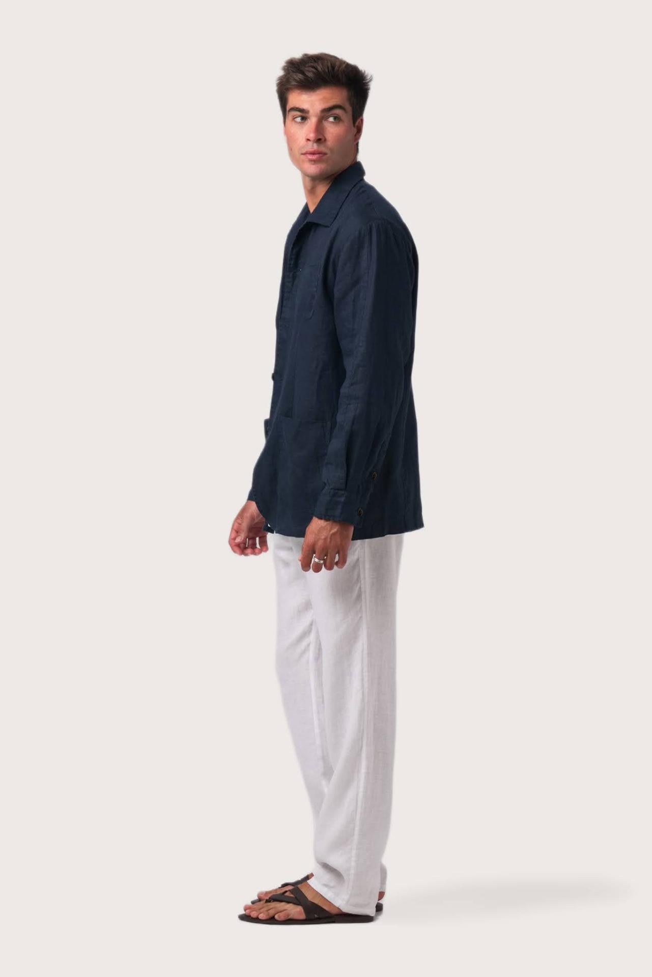 Side profile of the navy linen jacket showcasing its comfortable fit and effortless drape