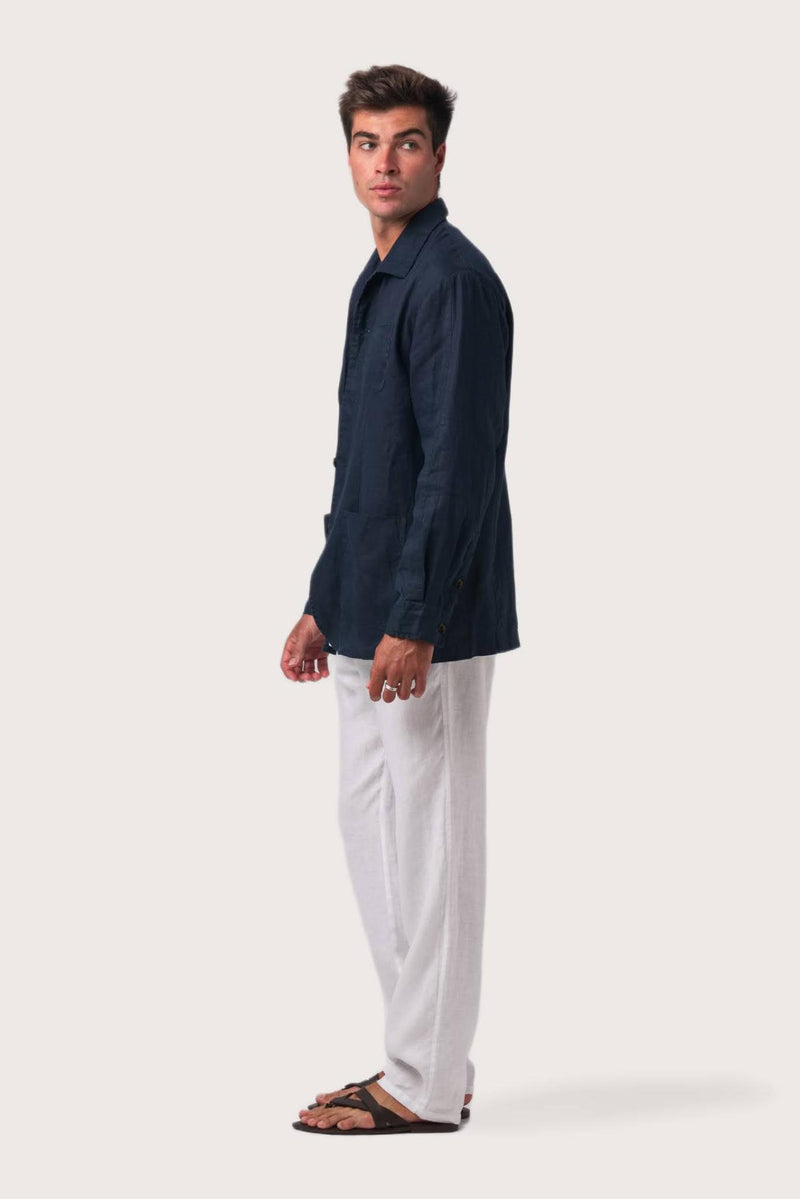 Side profile of the navy linen jacket showcasing its comfortable fit and effortless drape