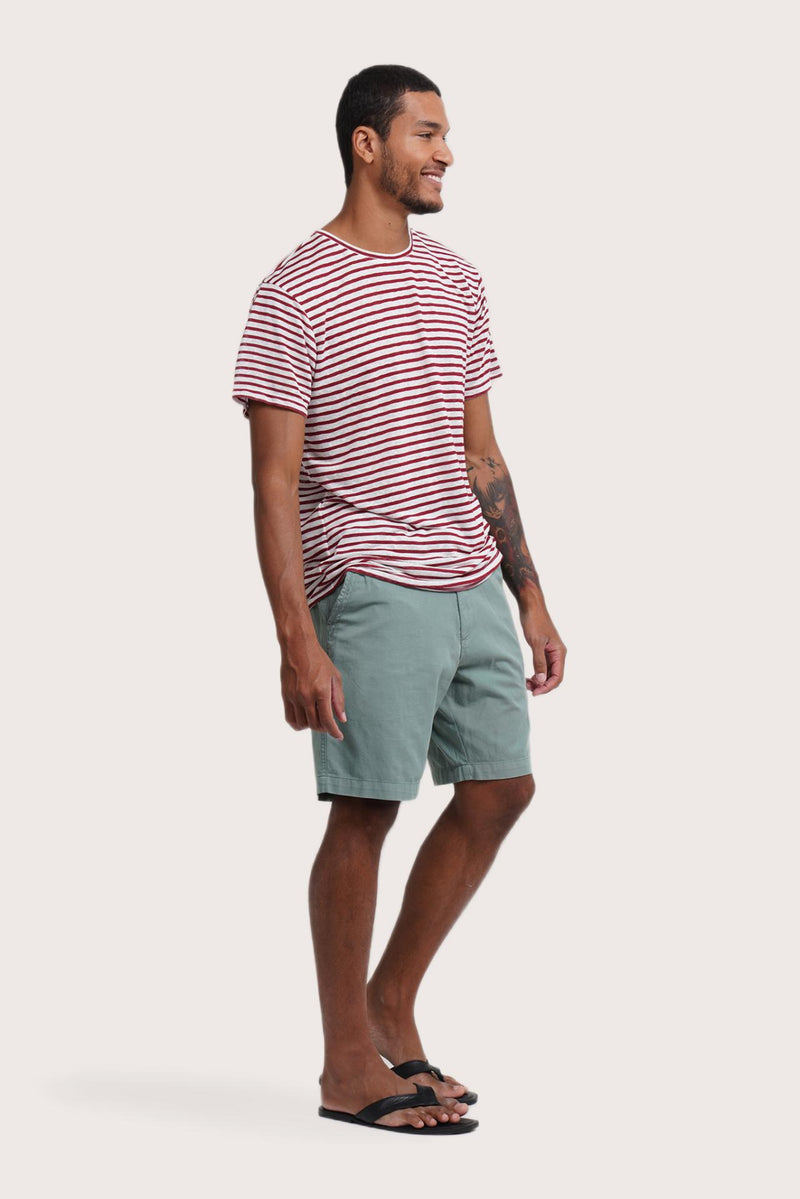 Side profile of the Geva T-shirt Stripe in Maroon by By The Sea Bali – relaxed drape and understated island elegance