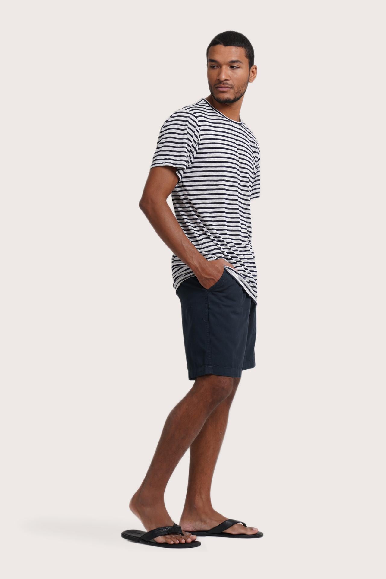 Side profile of the Geva T-shirt Stripe in Navy by By The Sea Bali – relaxed drape and understated island elegance
