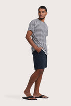 Side profile of the Geva T-shirt Stripe in Navy by By The Sea Bali – relaxed drape and understated island elegance