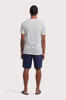 Back view of the By The Sea Bali Geva T-shirt Stripe in Paste Green – clean tailoring and refined craftsmanship