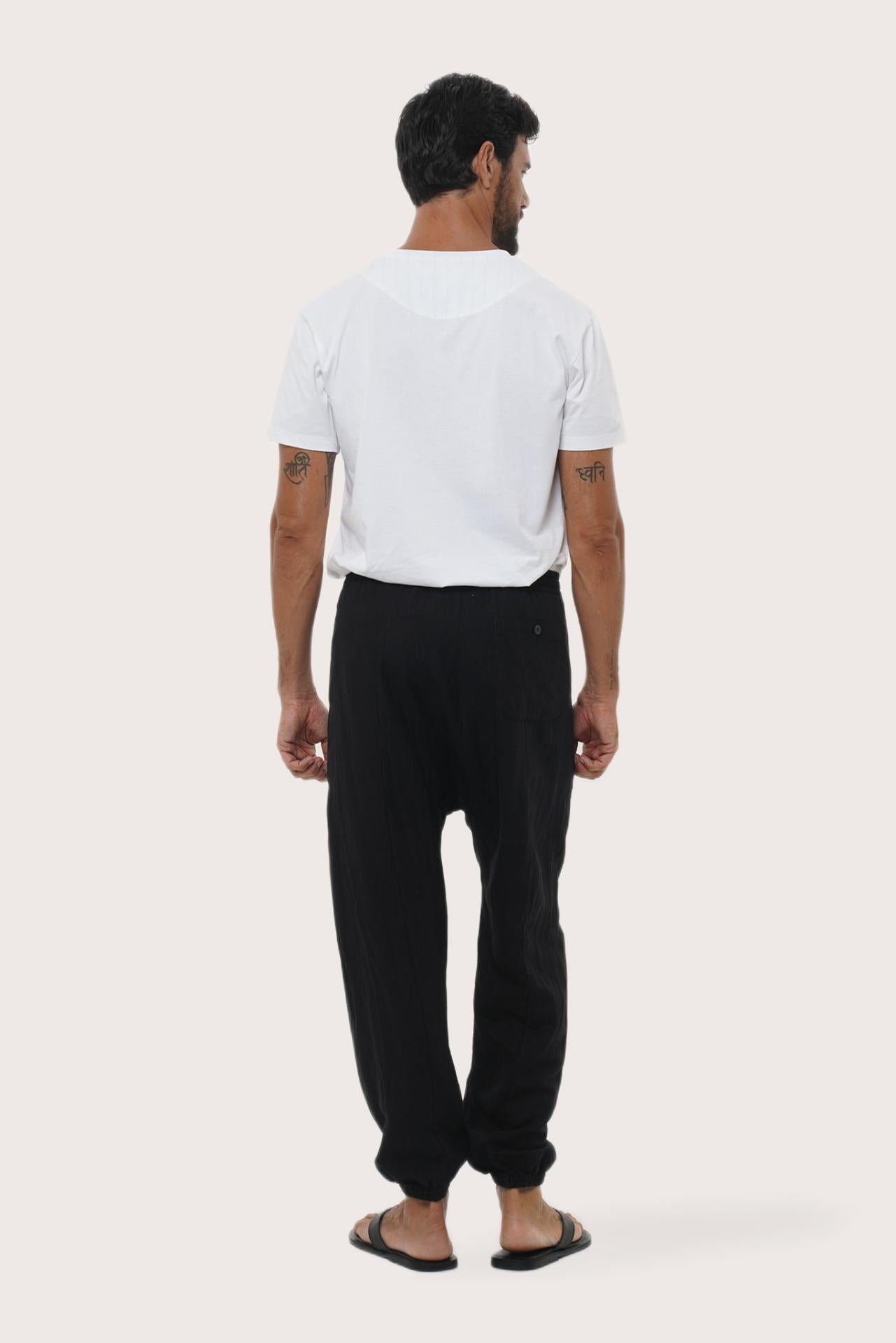 Back view of the black linen rayon loose pants with a relaxed and flowing silhouette