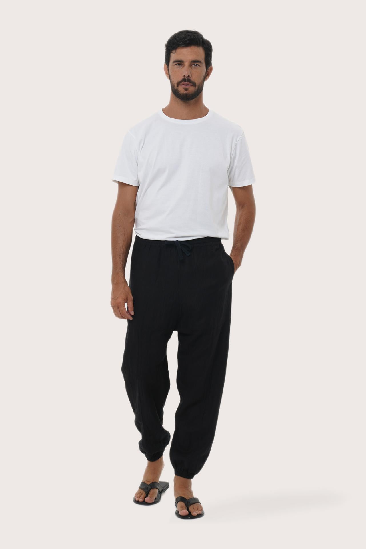 Model wearing the black linen rayon Goa loose pants by By The Sea Bali