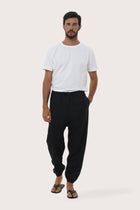 Model wearing the black linen rayon Goa loose pants by By The Sea Bali