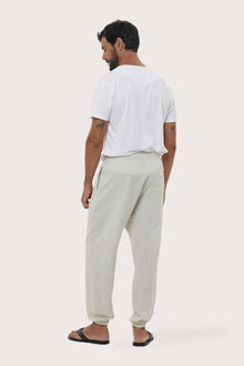 Back view of the ivory linen rayon loose pants with a relaxed and flowing silhouette
