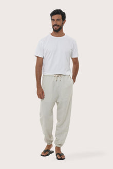 Model wearing the ivory linen rayon Goa loose pants by By The Sea Bali