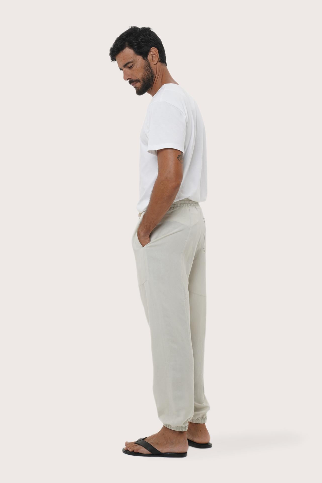Side profile of the ivory linen rayon Goa loose pants showcasing their effortless drape
