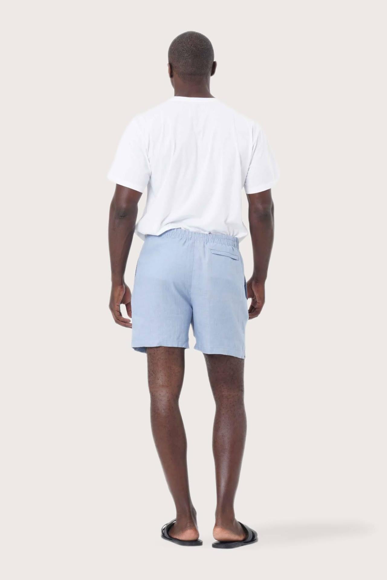 Back view of the blue linen shorts with a relaxed and tailored silhouette
