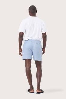 Back view of the blue linen shorts with a relaxed and tailored silhouette