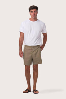 Model wearing the olive linen Gowa shorts by By The Sea Bali