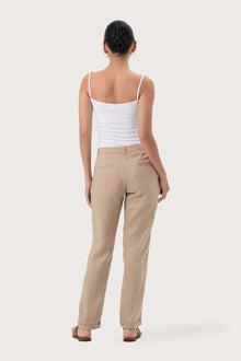Back view of the Hampton Women's Linen Pants Creme highlighting the garment shape and drape.