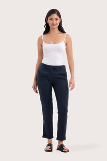 Woman wearing the Hampton Women's Linen Pants Navy designed for effortless resortwear and tropical living by By The Sea Bali.