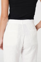 Back view of the Hampton Women's Linen Pants Off White highlighting the garment shape and drape.