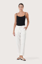 Woman wearing the Hampton Women's Linen Pants Off White designed for effortless resortwear and tropical living by By The Sea Bali.