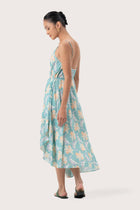 Back view of the Ilona Wrapped Dress Tosca Green highlighting the garment shape and drape