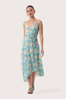 Woman wearing the Ilona Wrapped Dress Tosca Green designed for effortless resortwear and tropical living by By The Sea Bali