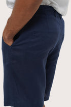 Detailed back view highlighting the relaxed silhouette and linen craftsmanship