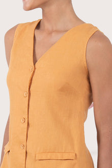 Close up detail of the Isla Linen Dress Orange  highlighting craftsmanship and design features