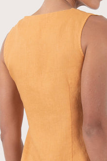 Close up detail of the Isla Linen Dress Orange  highlighting craftsmanship and design features