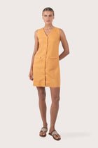 Front view of the Isla Linen Dress Orange showcasing its silhouette and relaxed fit