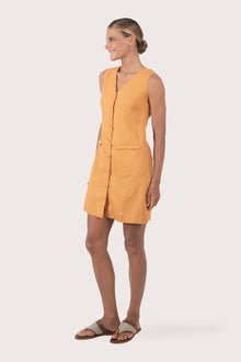 Side profile of the Isla Linen Dress Red showing its cut and natural movement