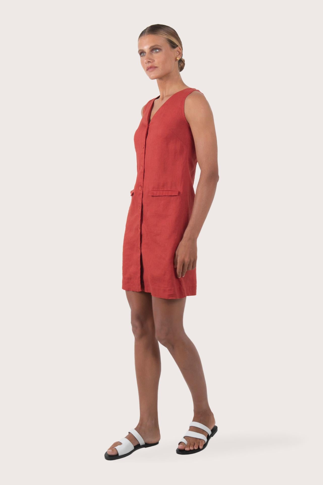 Side profile of the Isla Linen Dress Red showing its cut and natural movement