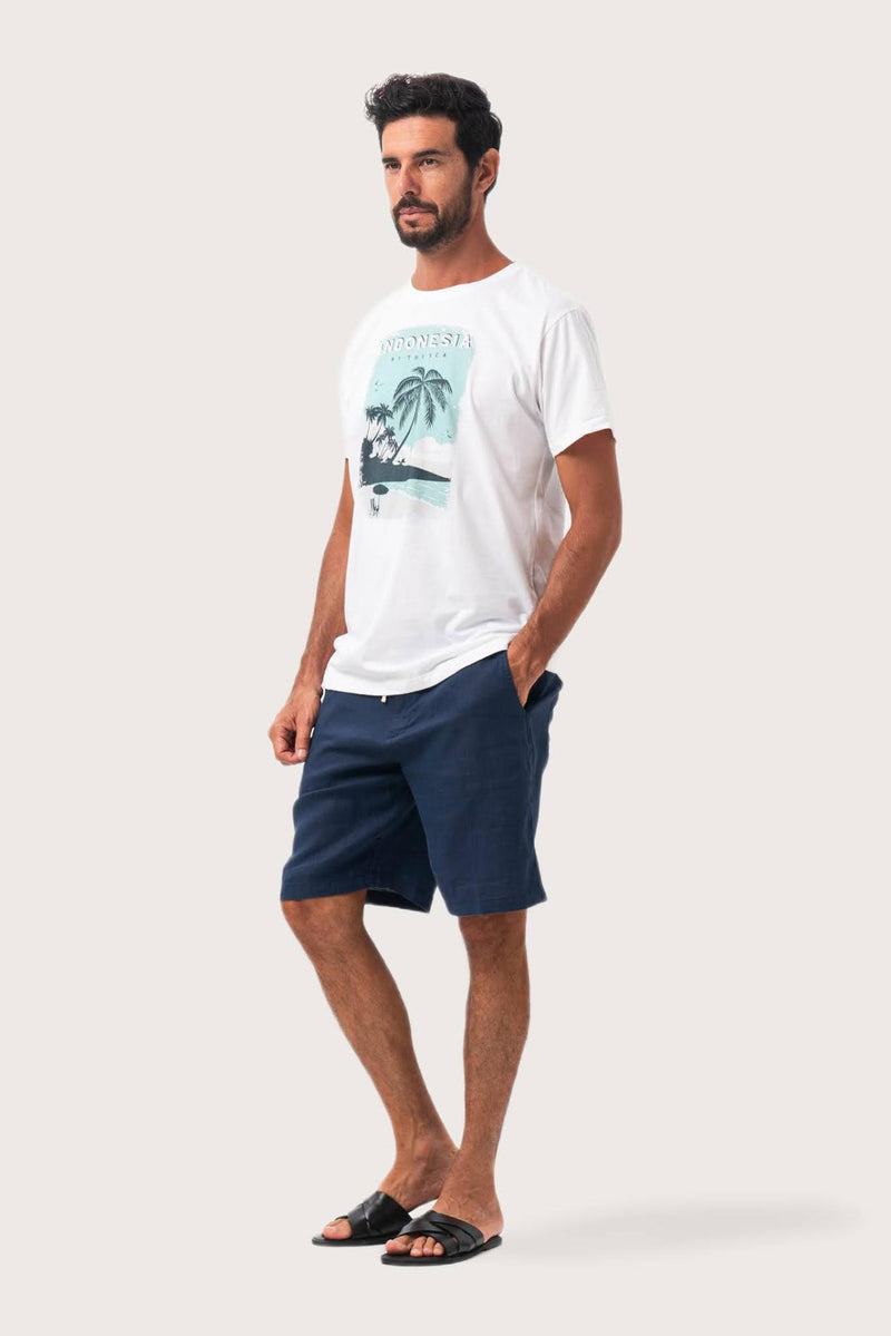 Side profile of the Isola Print T-shirt Palm Tree and Ocean by By The Sea Bali – relaxed drape and understated island elegance