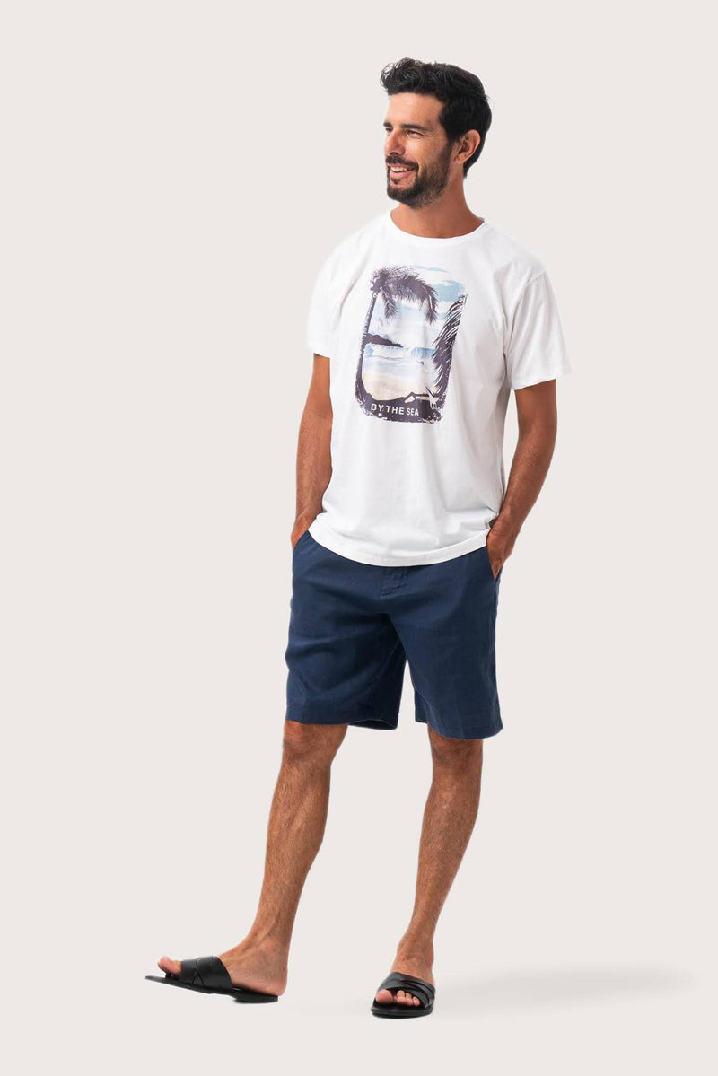 Side profile of the Isola Print T-shirt Palm Tree and Waves by By The Sea Bali – relaxed drape and understated island elegance