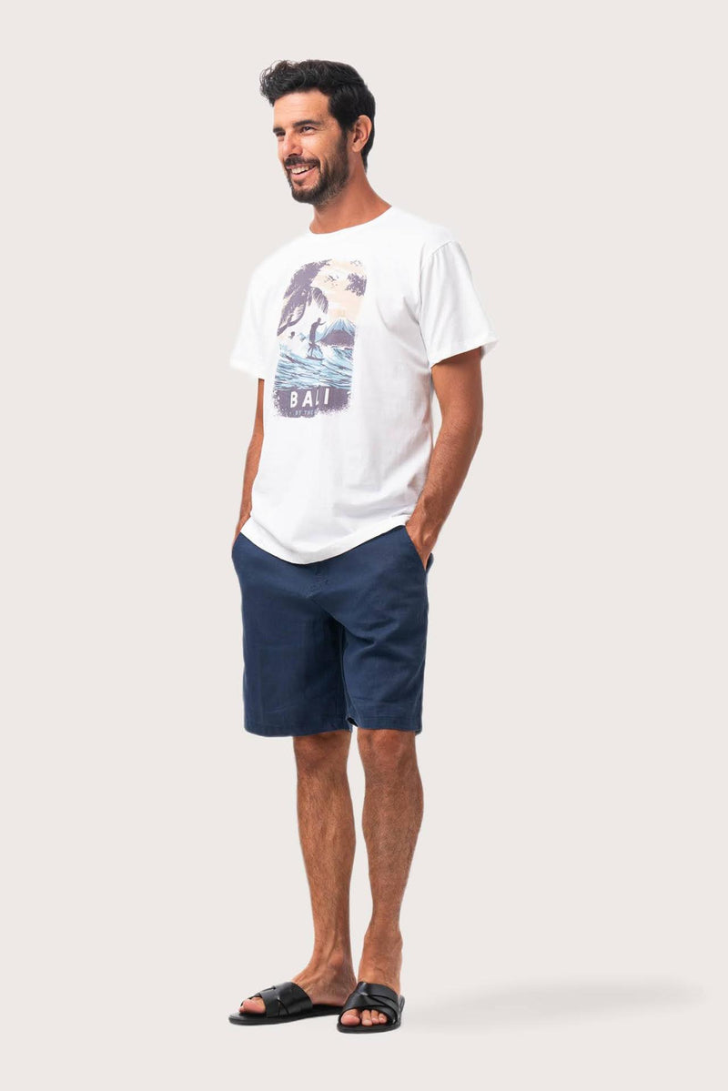 Side profile of the Isola Print T-shirt Wave and Surfer by By The Sea Bali – relaxed drape and understated island elegance