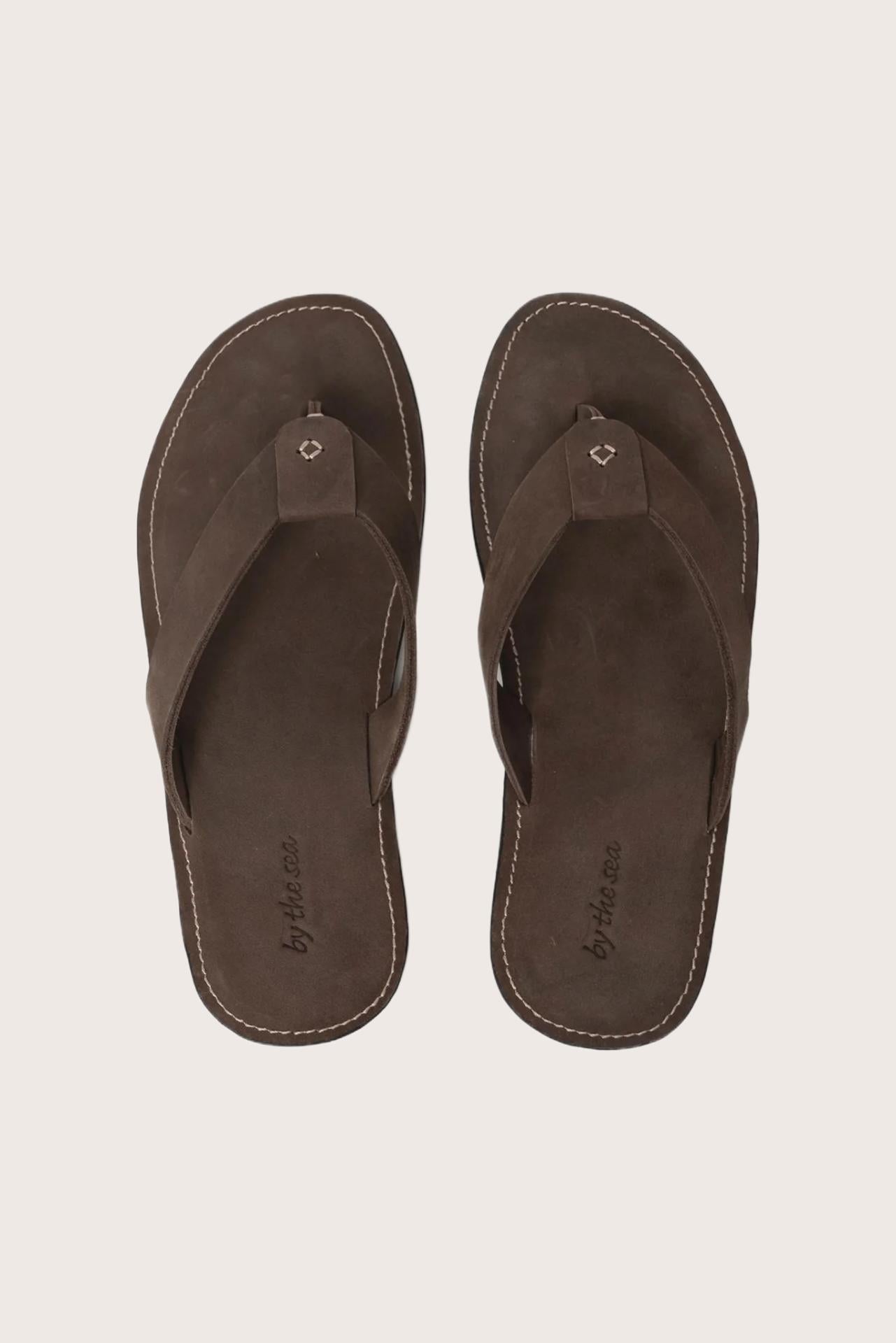Jaco sandal in brown shown in a global view highlighting its full silhouette and refined resort design