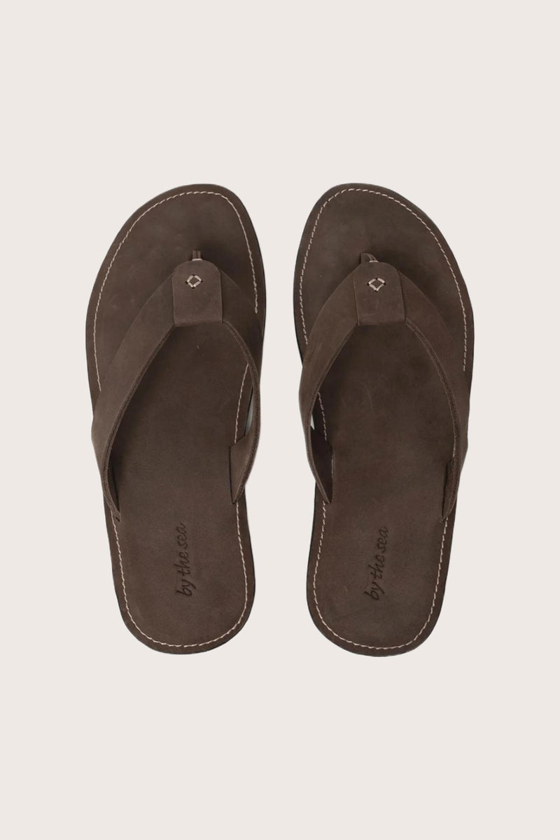 Jaco sandal in brown shown in a global view highlighting its full silhouette and refined resort design