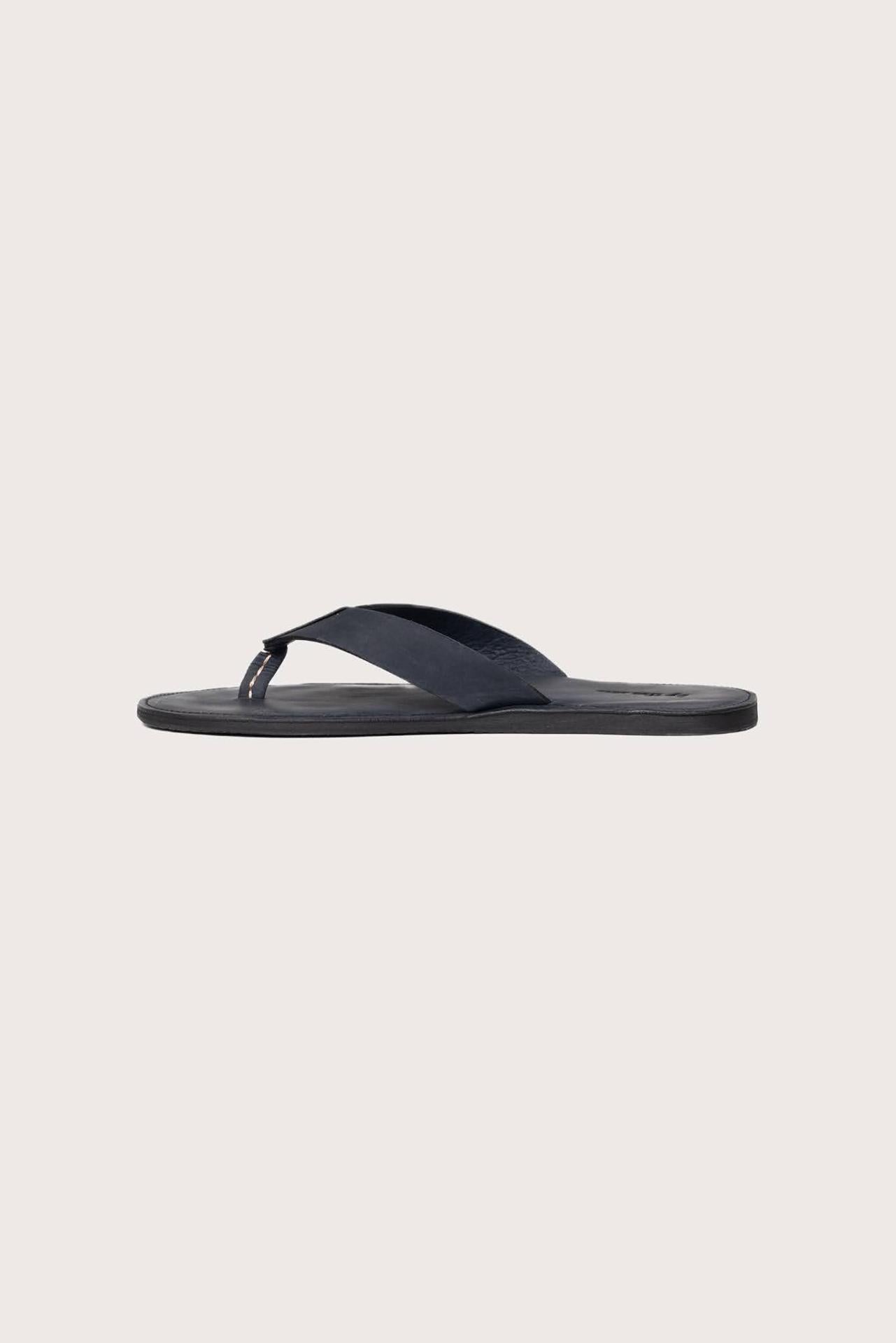 Side profile of Jaco sandal in navy highlighting sleek and modern resort footwear silhouette