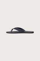 Side profile of Jaco sandal in navy highlighting sleek and modern resort footwear silhouette