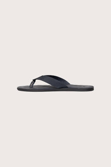 Side profile of Jaco sandal in navy highlighting sleek and modern resort footwear silhouette