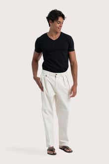 Side view of the creme Joey Pant showcasing its silhouette