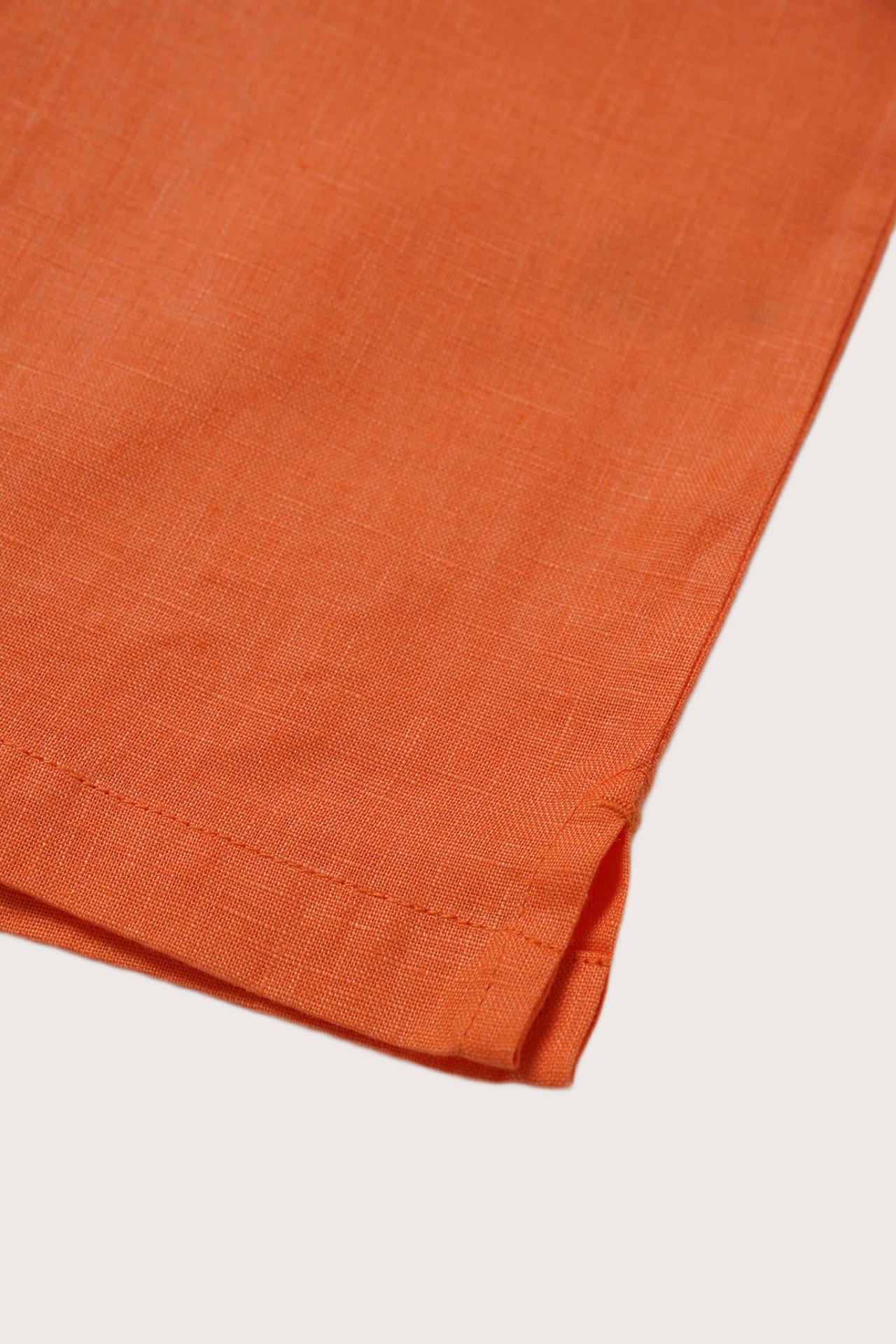 Refined resortwear styling in a vibrant Orange linen shade