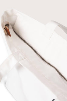 Angled view of the Kaia Bag White revealing its refined construction and elegant details