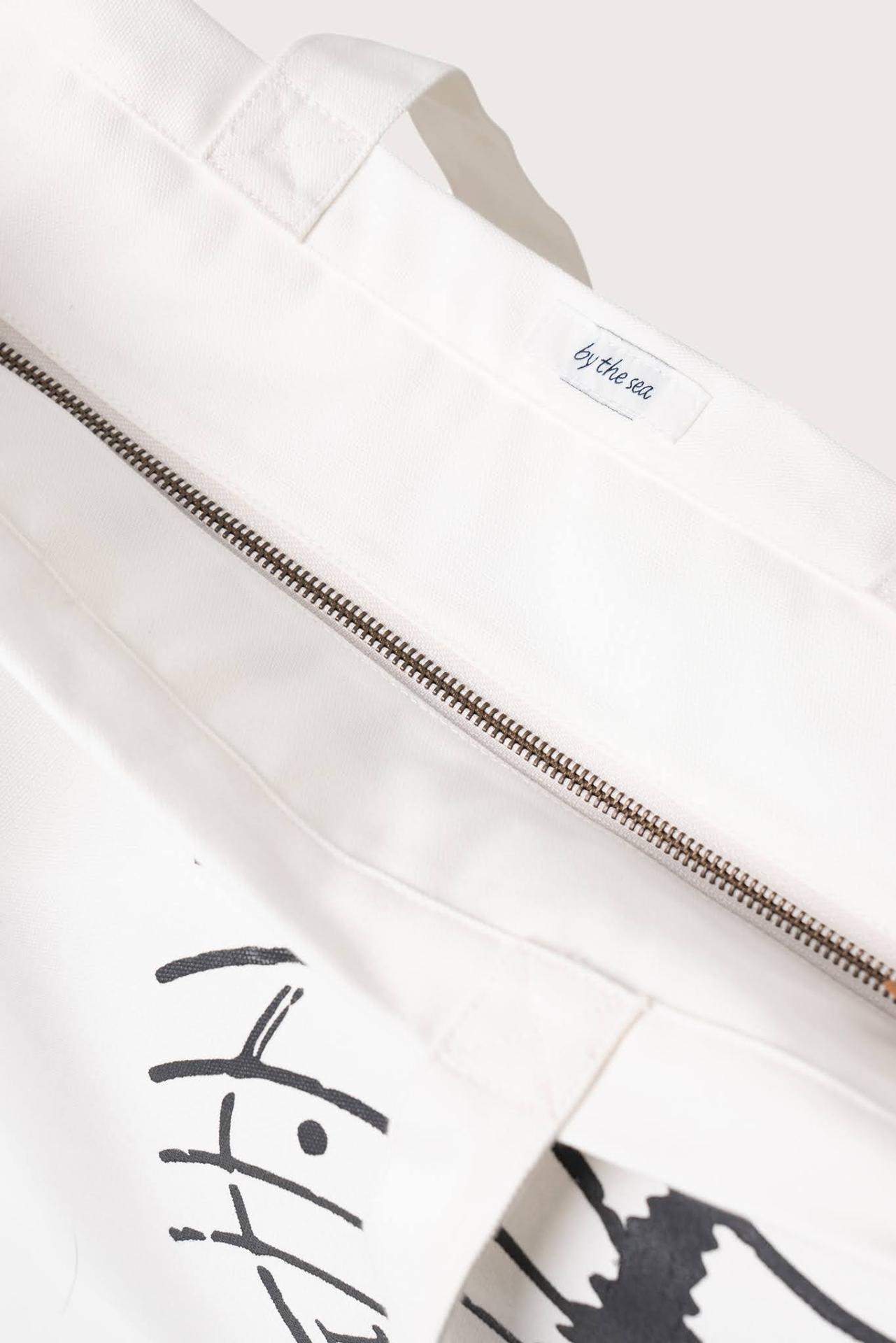 Angled view of the Kaia Bag White revealing its refined construction and elegant details