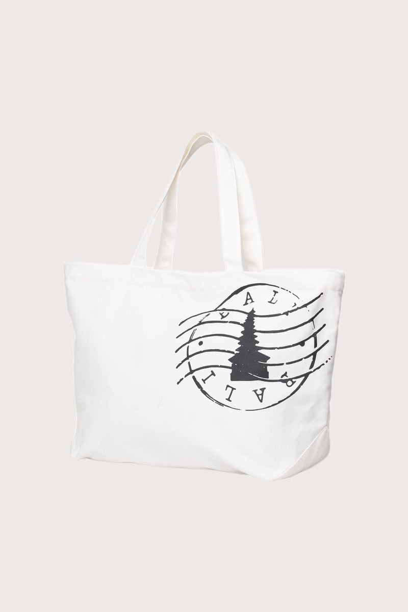 Kaia Bag White styled in a tropical resort setting with effortless coastal elegance