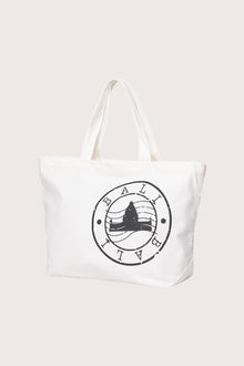 Luxury resort styling featuring the Kaia Bag White in a tropical seaside setting