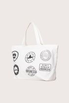 Kaia Bag White styled in a tropical resort setting with effortless coastal elegance
