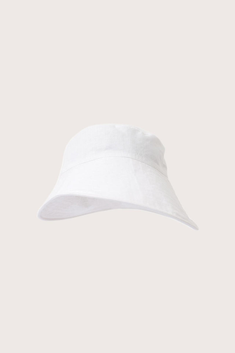 Angled view of the Kalulla Cotton Hat Off White emphasizing its timeless silhouette and effortless elegance